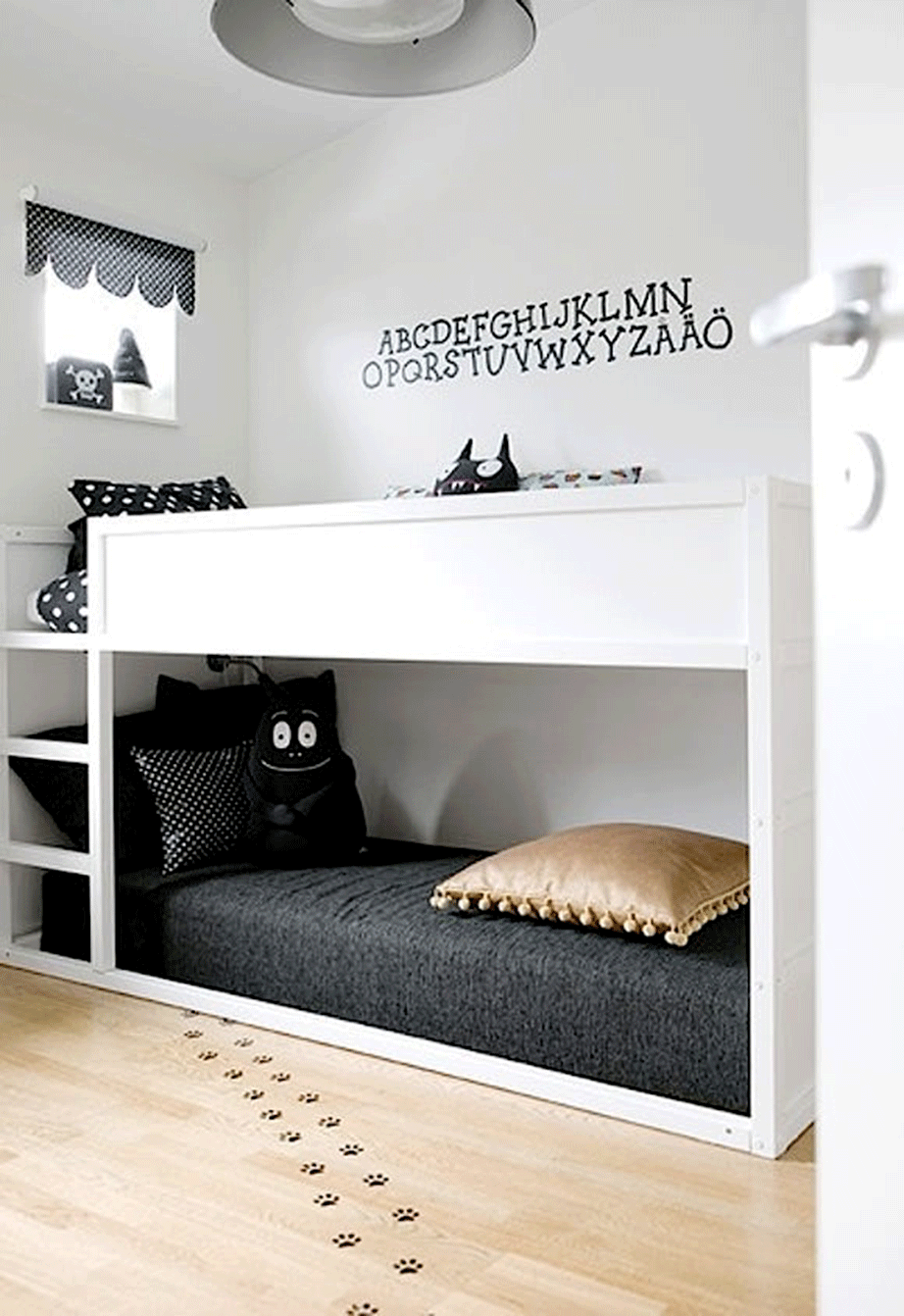 White and black may not be your first choice as it is a children's bedroom but it is a modern and very stylish choice.